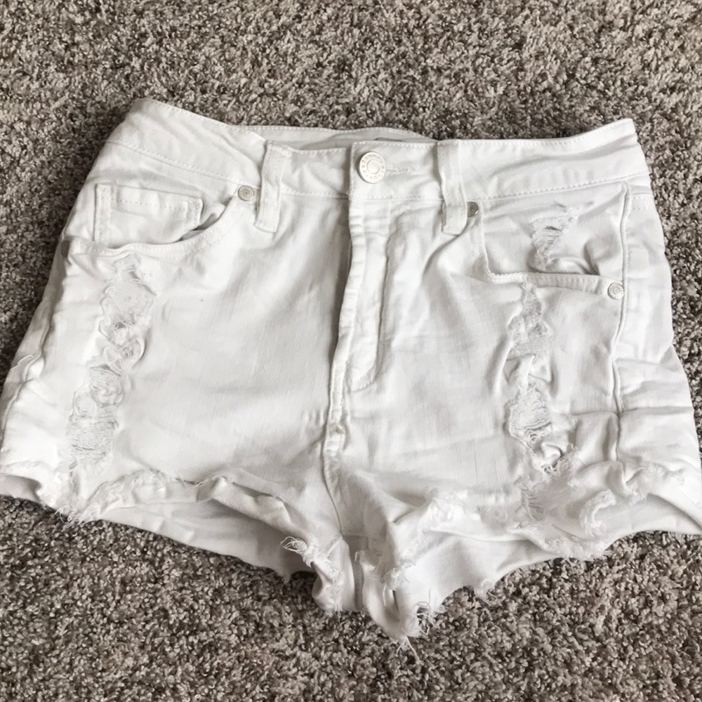 White distressed jean shorts